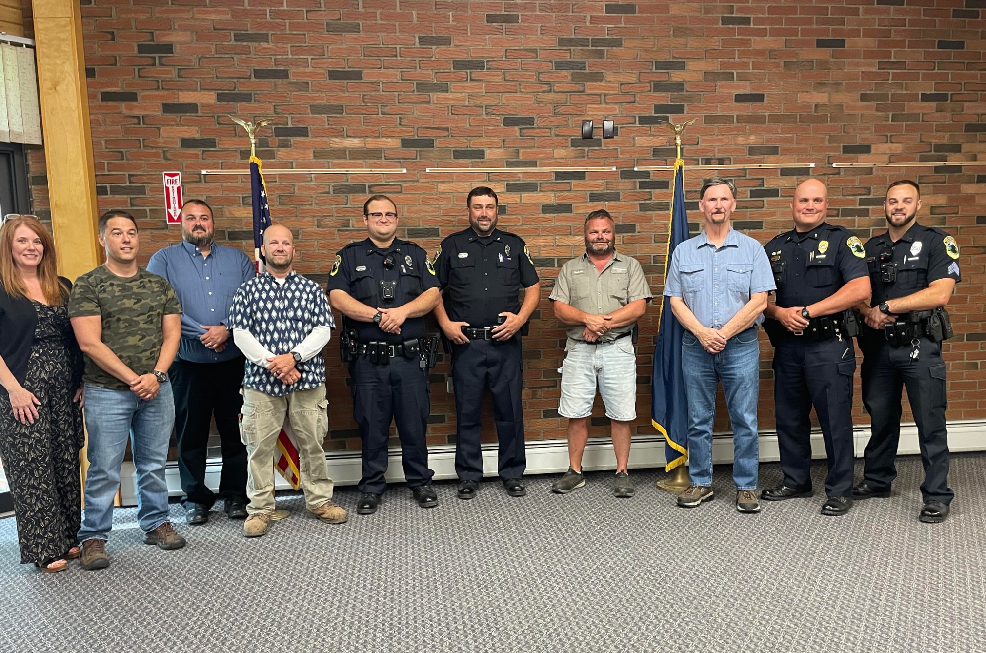 FORT KENT, Maine -- July 11, 2022 -- Two new police officers, Mark Belanger and Daniel Plourde have joined the Fort Kent Police Department. The new officers were recognized at a Monday, July 11 town council meeting. From left, are, Suzie Paradis, Fort Kent town manager; councilman Joey Ouellette, councilman Corey Pelletier, council chair Jake Robichaud, Officer Daniel Plourde, Officer Mark Belanger, councilman Andrew Caron, councilman Carrol Theriault, Chief Michael DeLena, and Sgt. Garrett Albert. (Courtesy of Stacy Belanger)